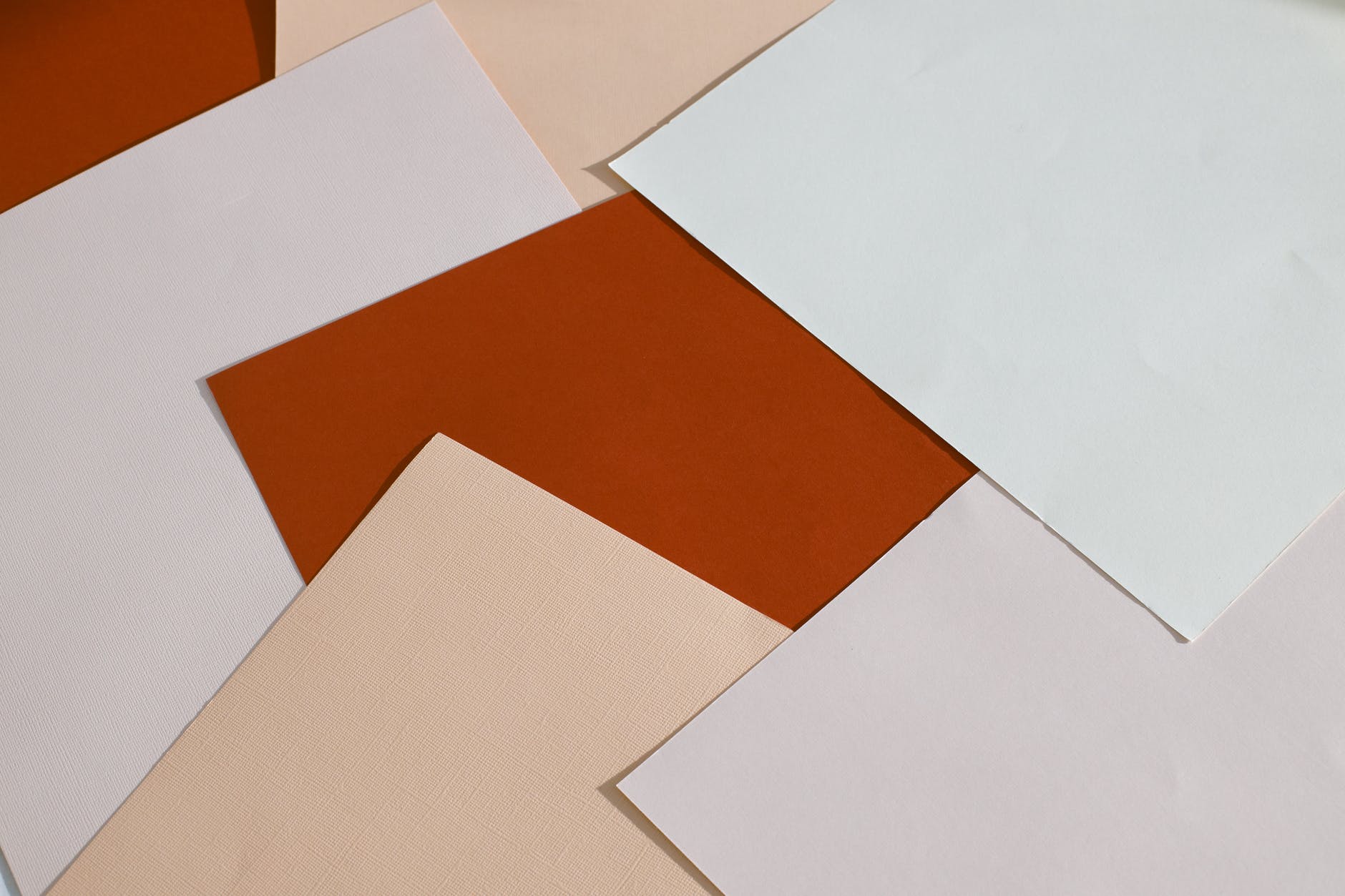 abstract background of various paper sheets scattered on table